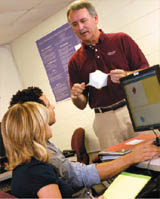 professor talking with students in class
